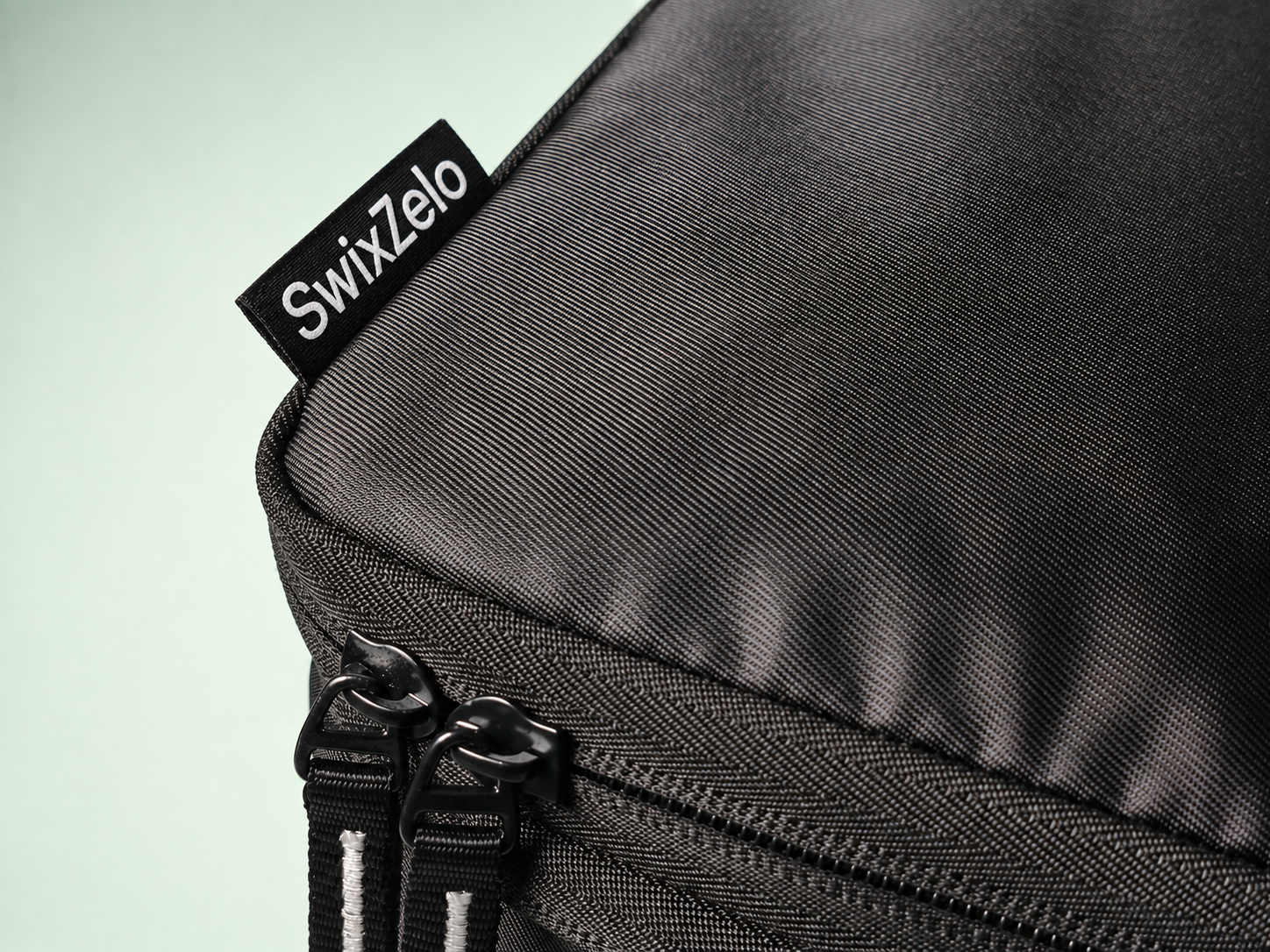 Swixzelo travel organizers arranged in a layered composition